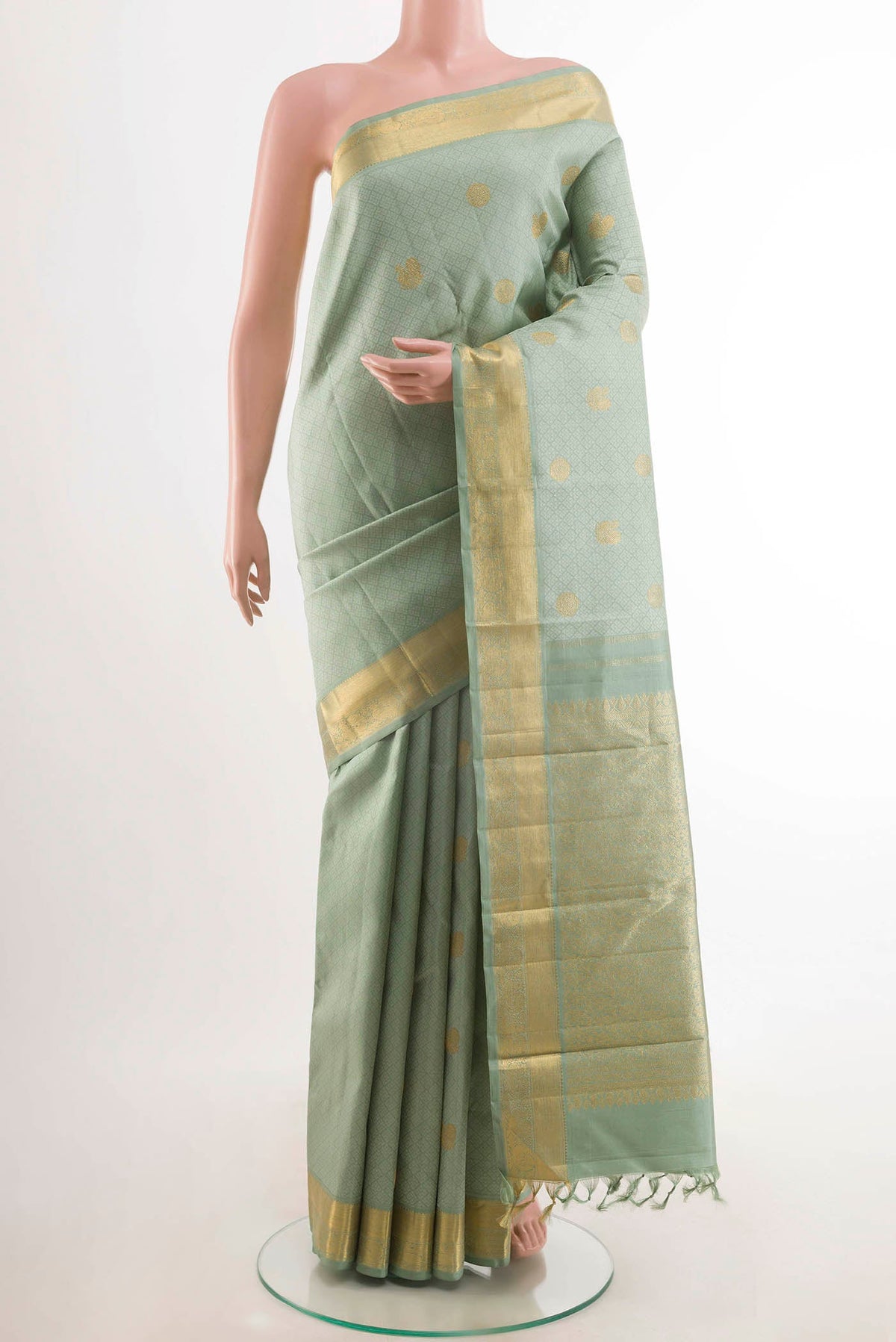 Sea Green Kanchipuram Silk Saree with Jacquard With Zari Butta on the body and Zari Border displayed on a mannequin