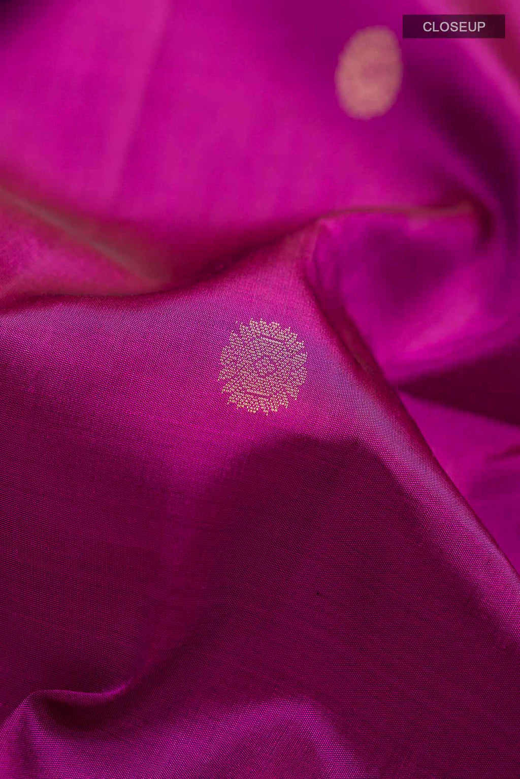 Close up of Purple Soft Silk Saree with Zari Butta on the body and Zari Border displaying folds
