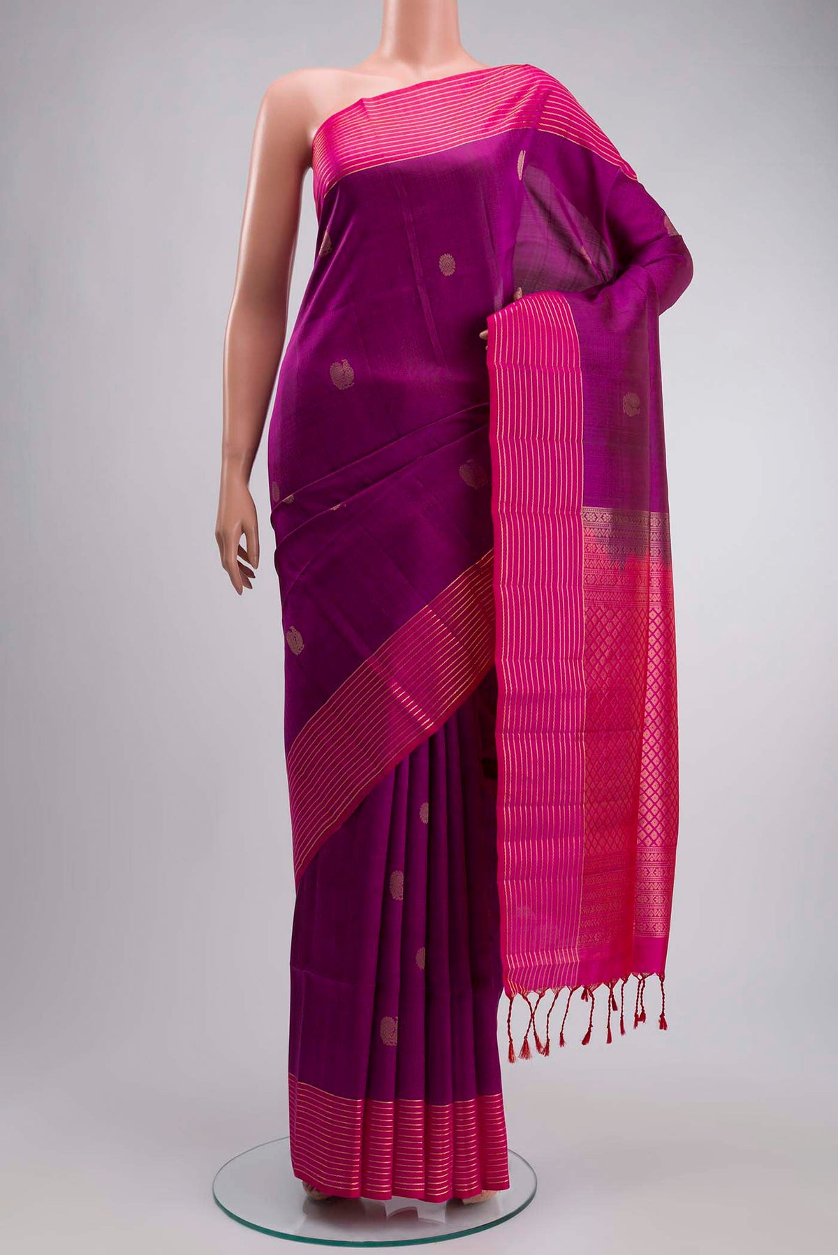 Purple Soft Silk Saree with Zari Butta on the body and Zari Border displayed on a mannequin