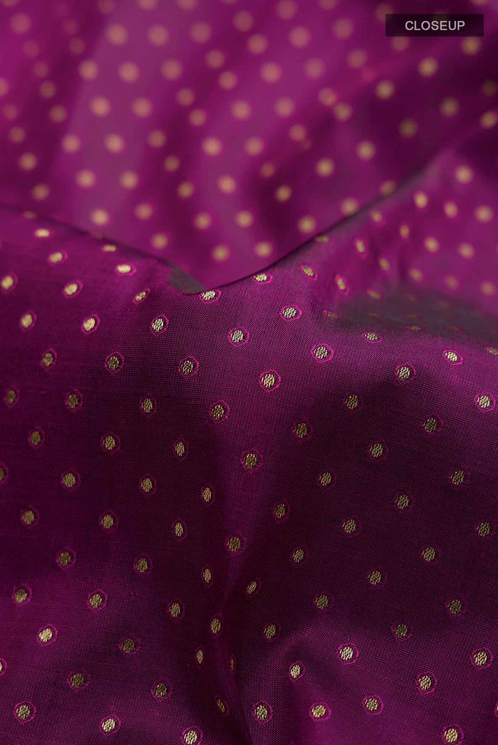 Close up of Purple Soft Silk Saree with Zari Butta on the body and Zari Border displaying folds