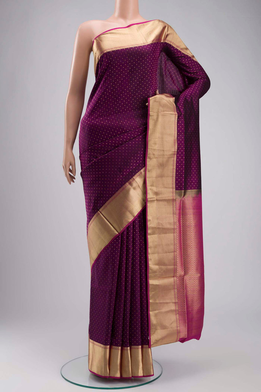 Purple Soft Silk Saree with Zari Butta on the body and Zari Border displayed on a mannequin