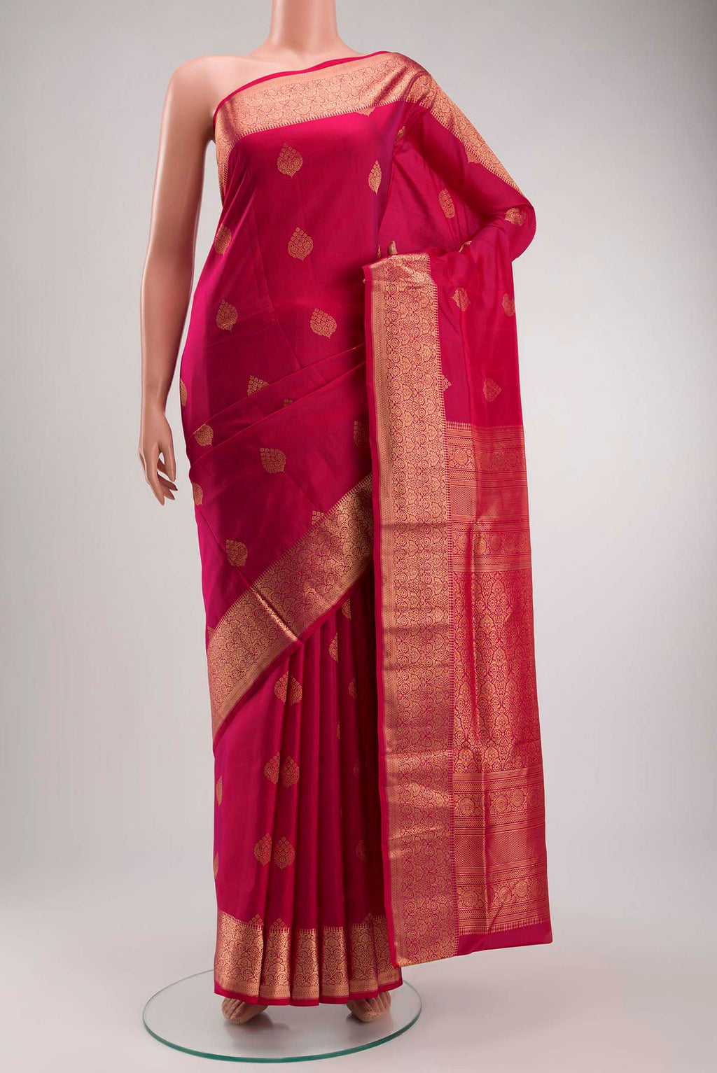 Pink Soft Silk Saree with Zari Butta on the body and Zari Border displayed on a mannequin