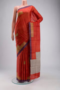 Rust Bhagalpuri Tussar Silk Saree with Printed design on the body and Plain Border displayed on a mannequin