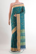 Blue Tussar Saree with Printed design on the body and Zari Border.  displayed on a mannequin