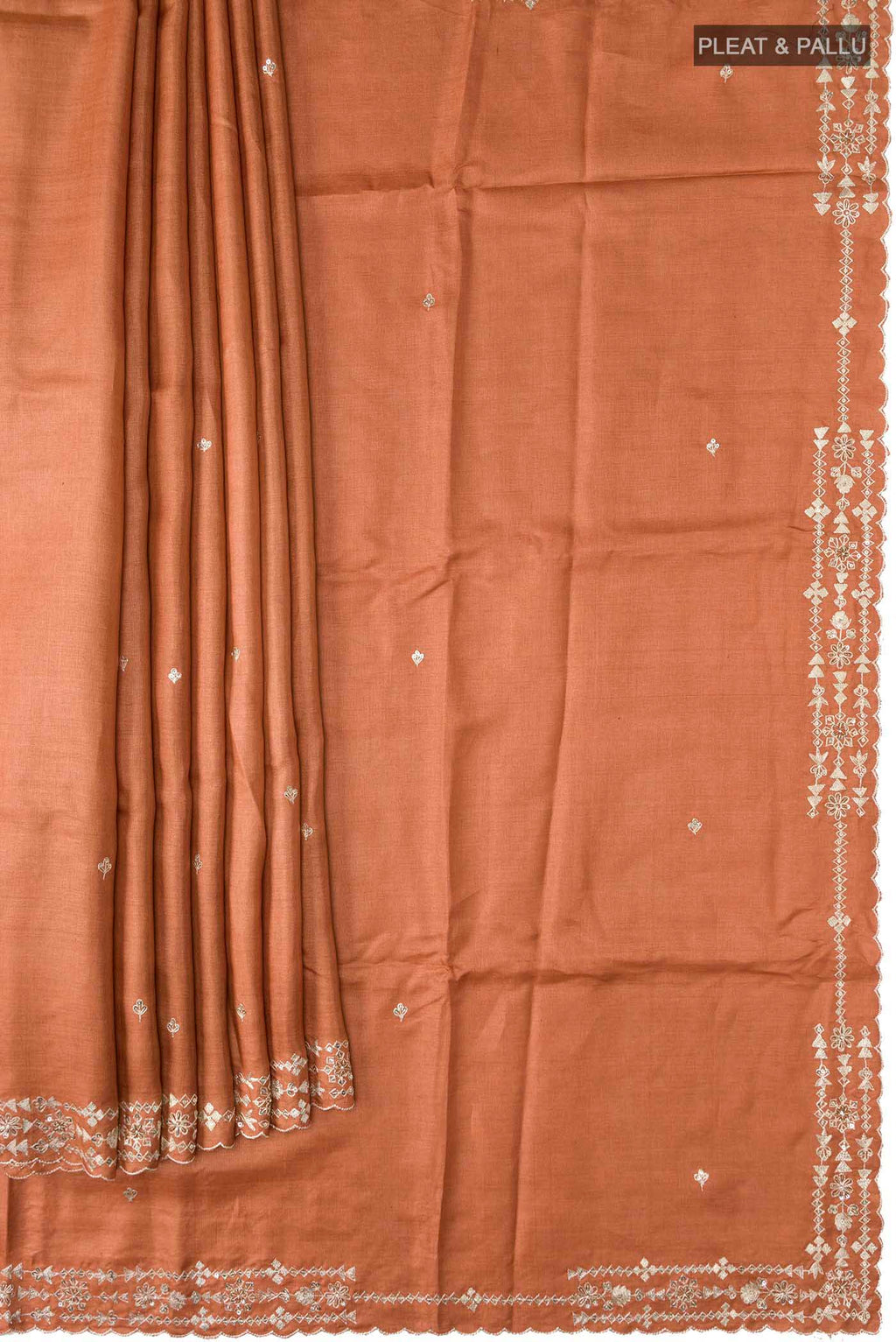 Pleats and pallu of Rust Bhagalpuri Tussar Silk Saree with Embroidery on the body and Embroidery Border