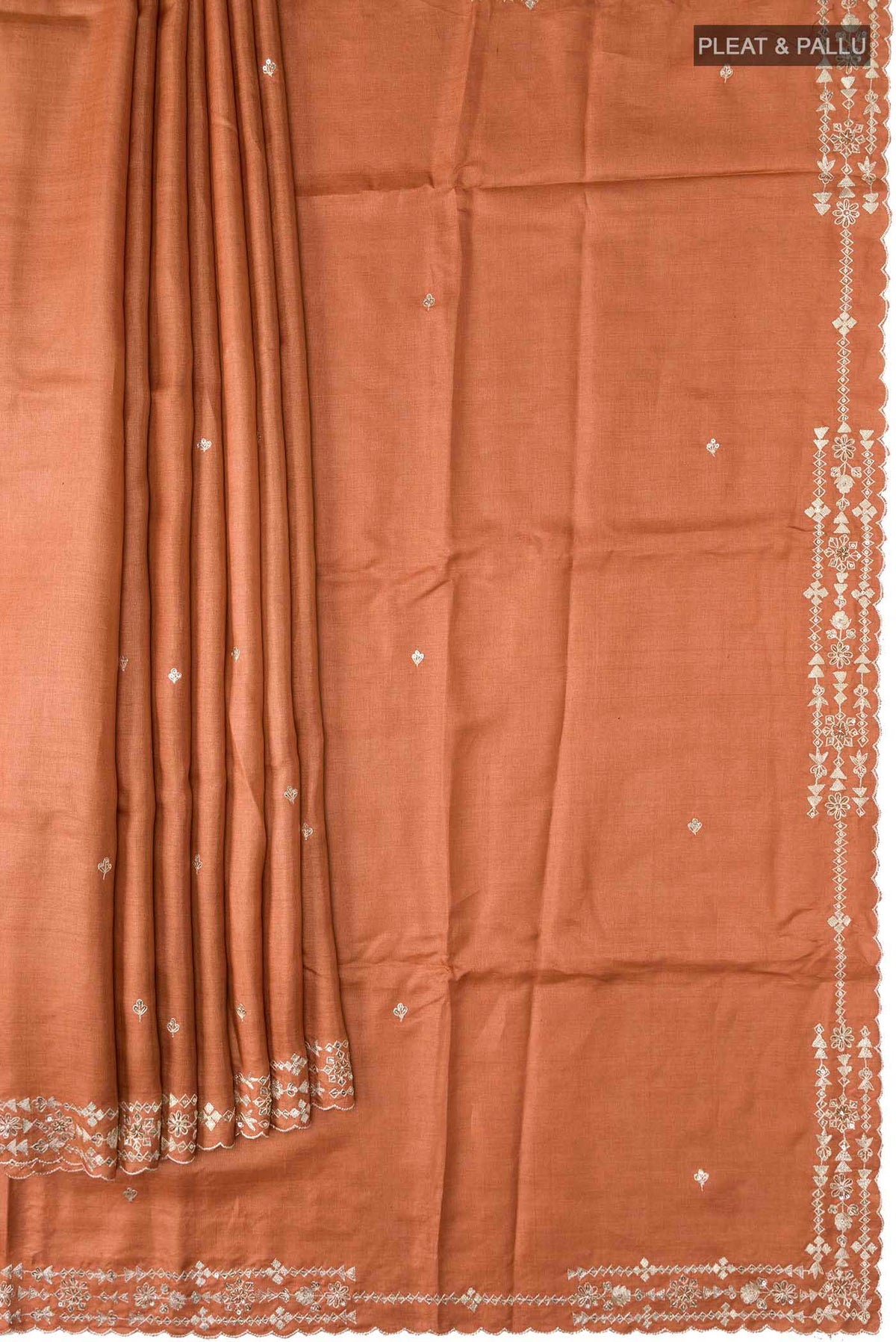 Pleats and pallu of Rust Bhagalpuri Tussar Silk Saree with Embroidery on the body and Embroidery Border