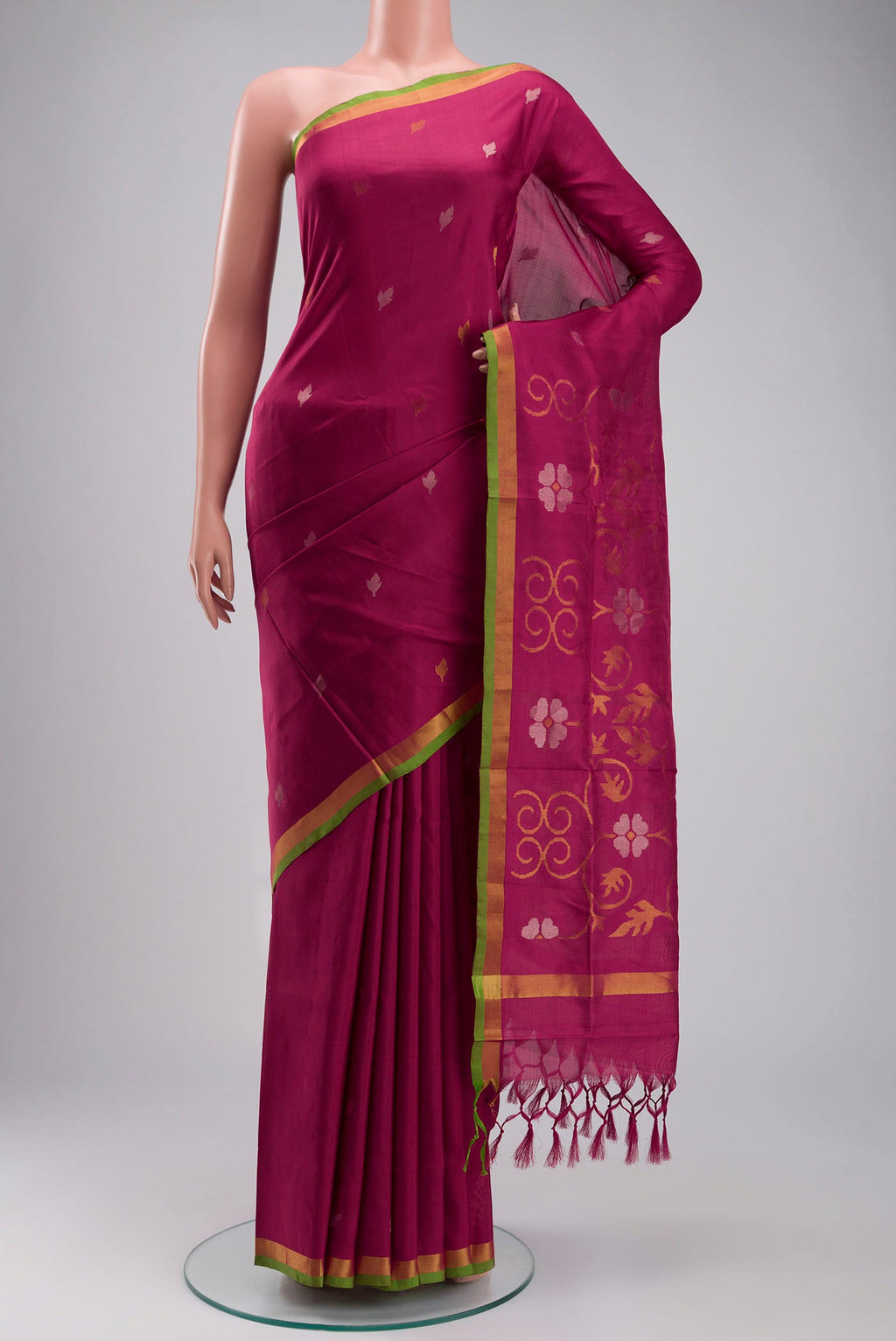 Pink Uppada Silk Saree with Zari Butta on the body and Zari Border displayed on a mannequin
