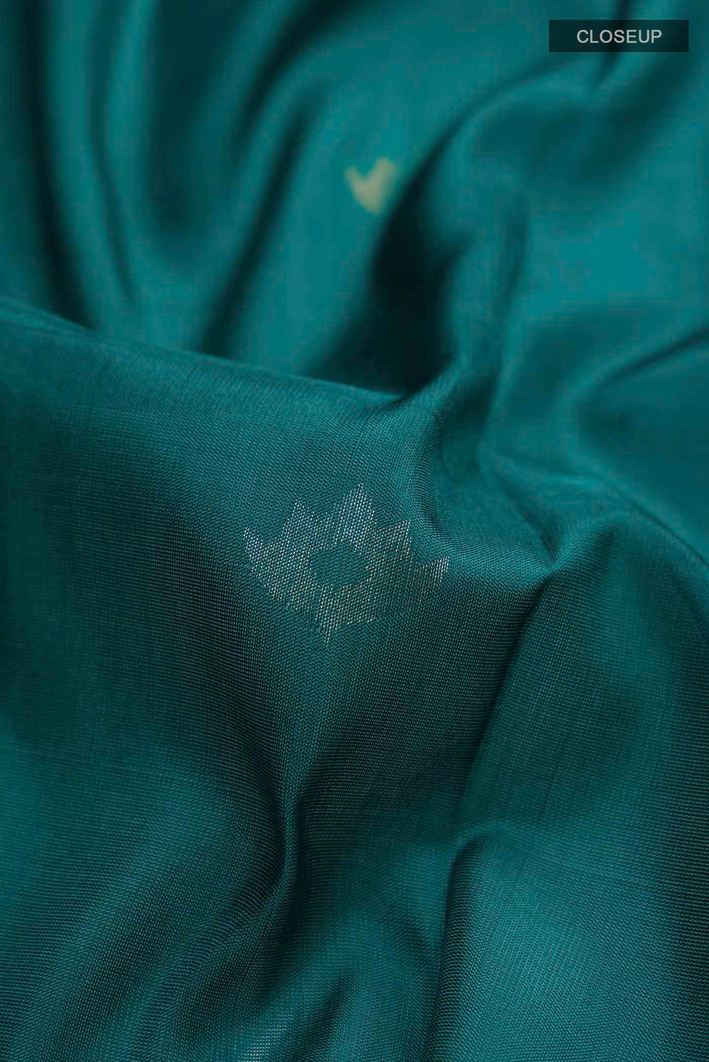 Close up of Blue Uppada Silk Saree with Zari Butta on the body and Zari Border displaying folds