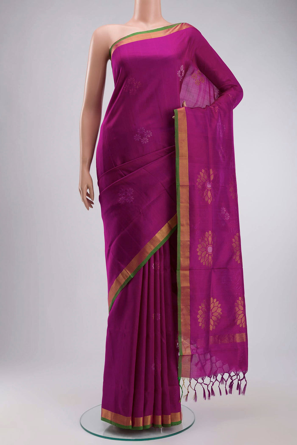 Magenta Uppada Silk Saree with Zari Butta on the body and Zari Border displayed on a mannequin
