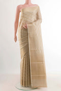 Beige Blended Kota Cotton Saree with Stripes on the body and Zari Border displayed on a mannequin