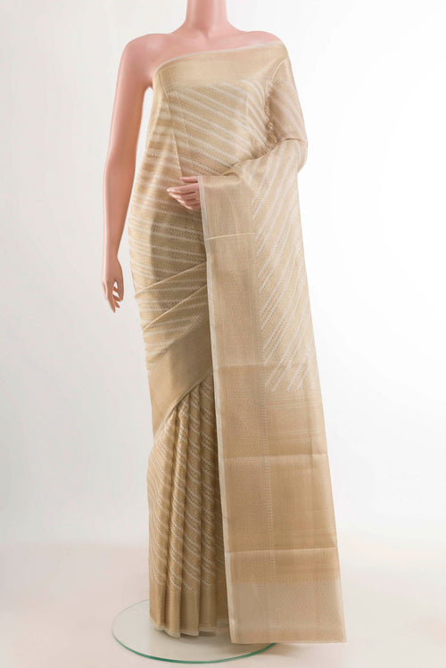 Beige Blended Kota Cotton Saree with Stripes on the body and Zari Border displayed on a mannequin
