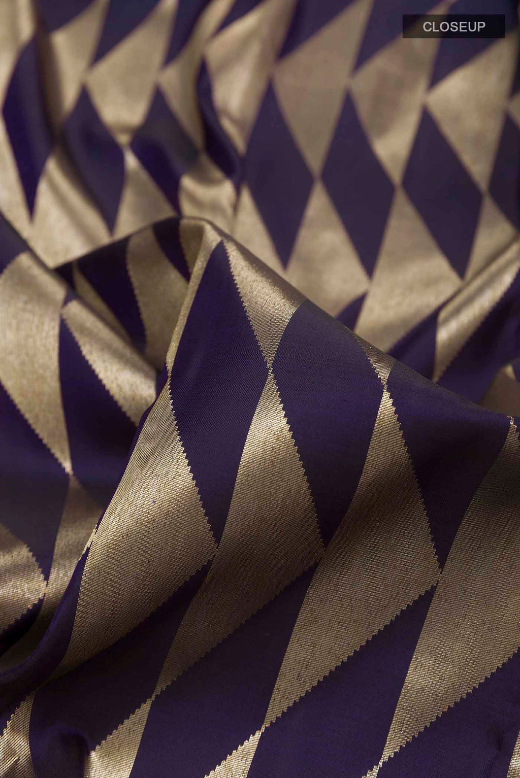 Close up of Dark Blue Kanchipuram Silk Saree with Zari Brocade on the body and Zari Border displaying folds