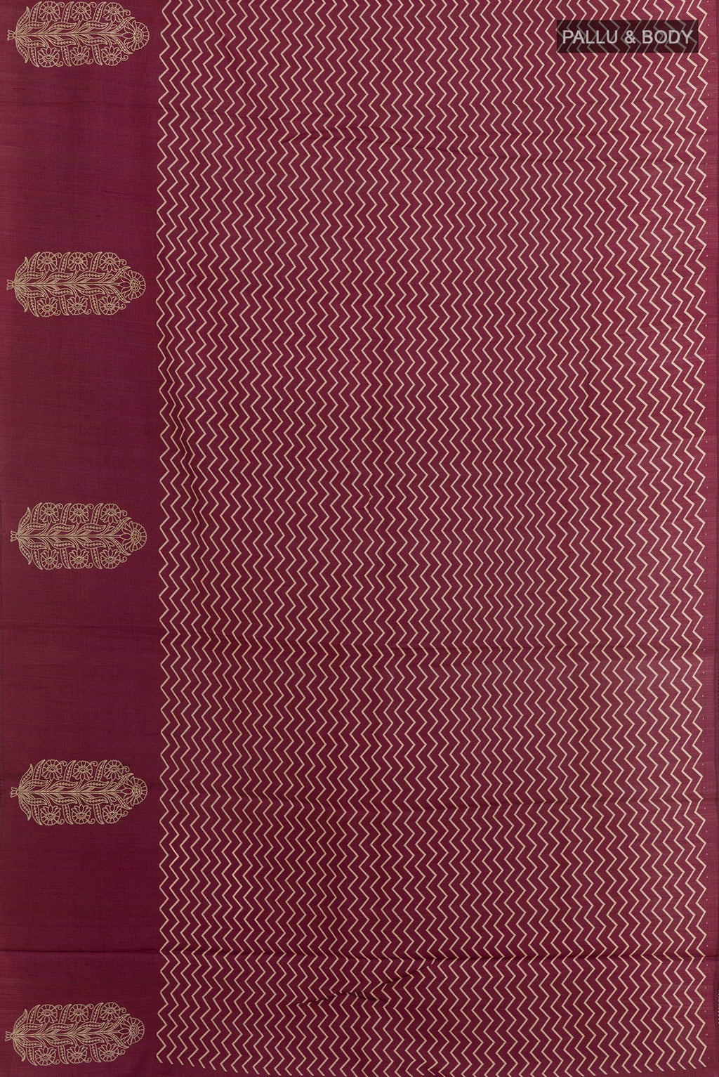 Flat view of Magenta Tussar Silk Saree with Printed design on the body and Zari Border. 