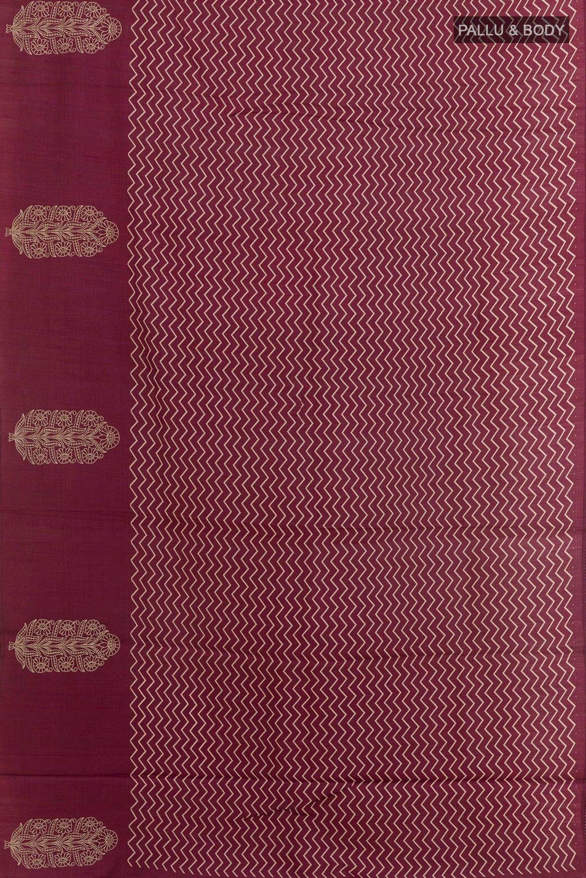 Flat view of Magenta Tussar Silk Saree with Printed design on the body and Zari Border. 
