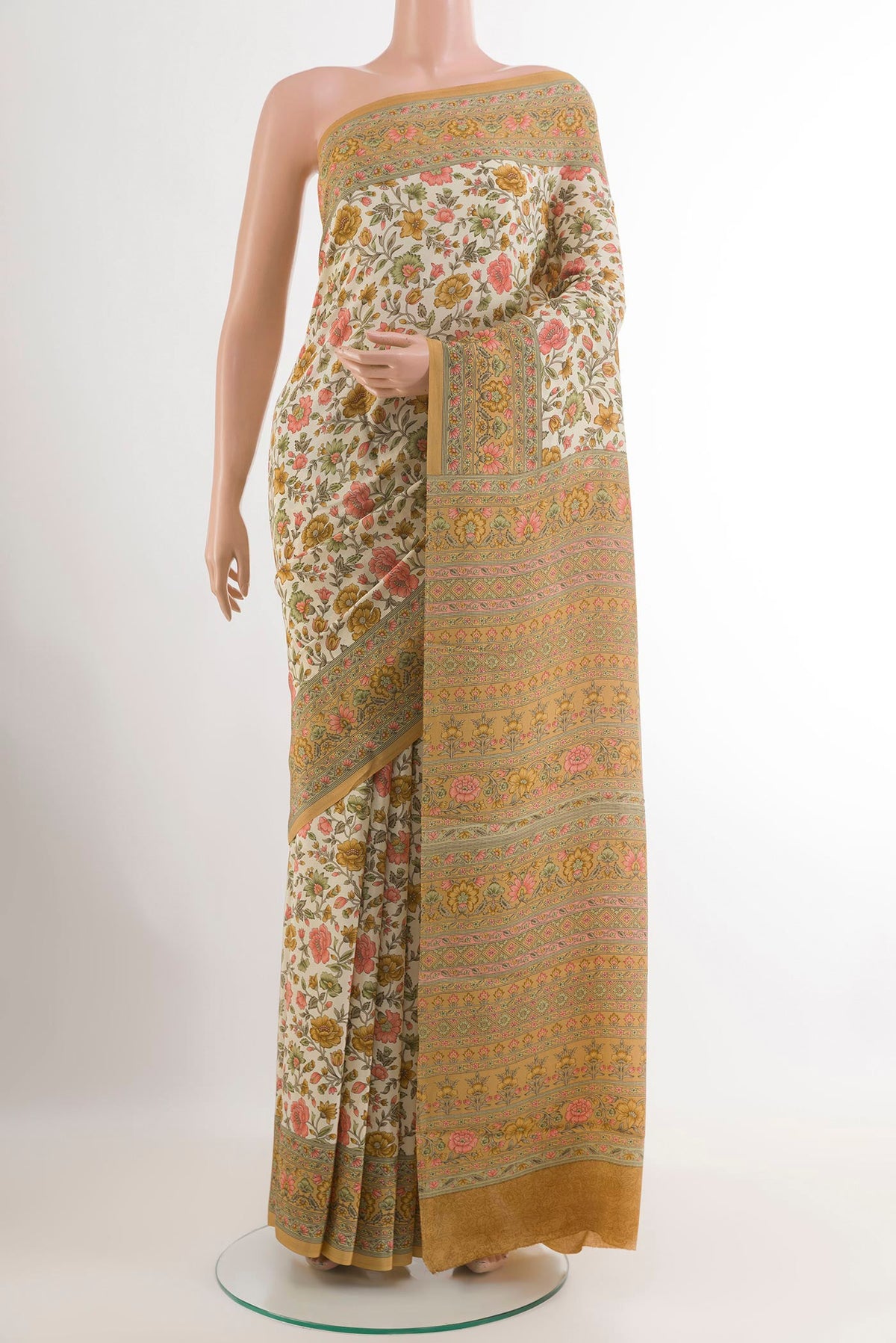 Off White Crepe Saree with Printed design on the body and Plain Border.  displayed on a mannequin