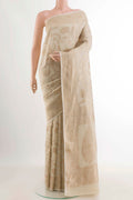 Off White Banarasi Tussar Georgette Saree with Zari Brocade on the body and Zari Border displayed on a mannequin