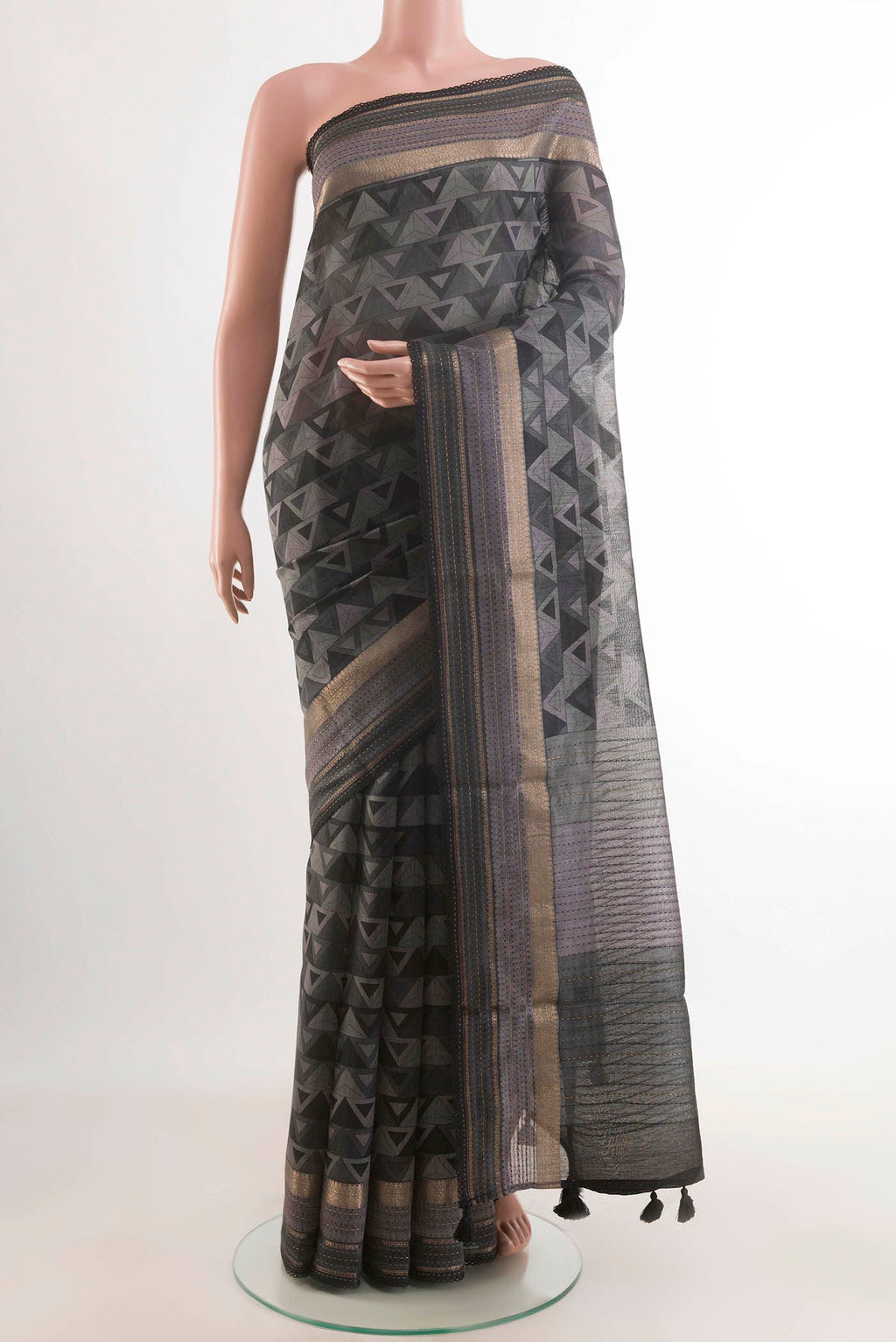 Grey Tussar Saree with Printed design on the body and Zari Border displayed on a mannequin