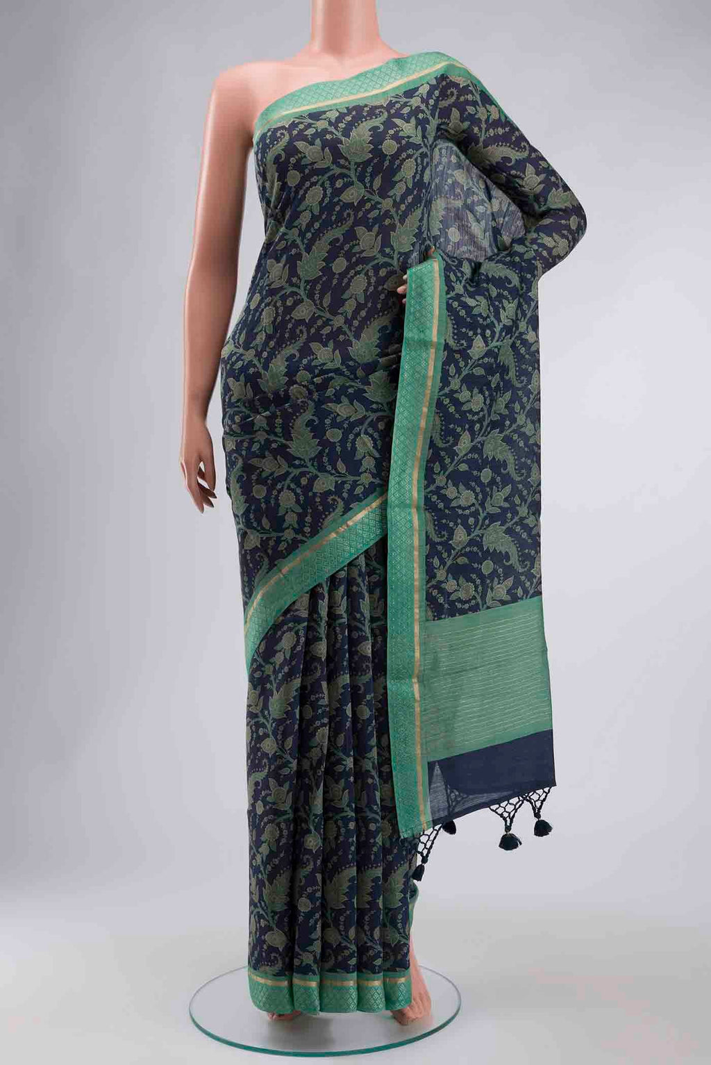 Blue Tussar Silk Saree with Printed design on the body and Zari Border displayed on a mannequin