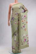 Green Mysore Crepe Saree with Printed design on the body and Plain Border displayed on a mannequin