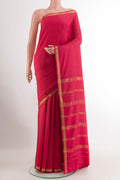 Pink Mysore Crepe Saree with Plain Body and Zari Border.  displayed on a mannequin