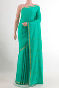Sea Green Mysore Crepe Saree with Plain Body and Zari Border.  displayed on a mannequin