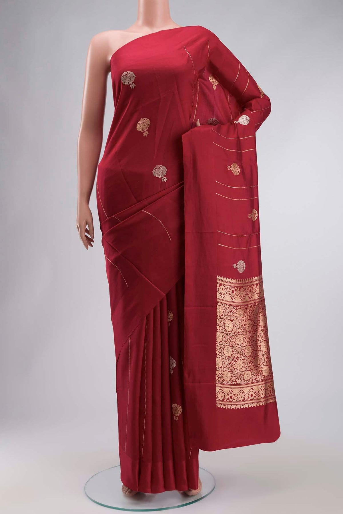 Red Banarasi Katan Silk Saree with Zari Butta on the body and Plain Border displayed on a mannequin