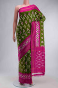 Green Pochampally Silk Saree with Ikat design on the body and Zari Border displayed on a mannequin