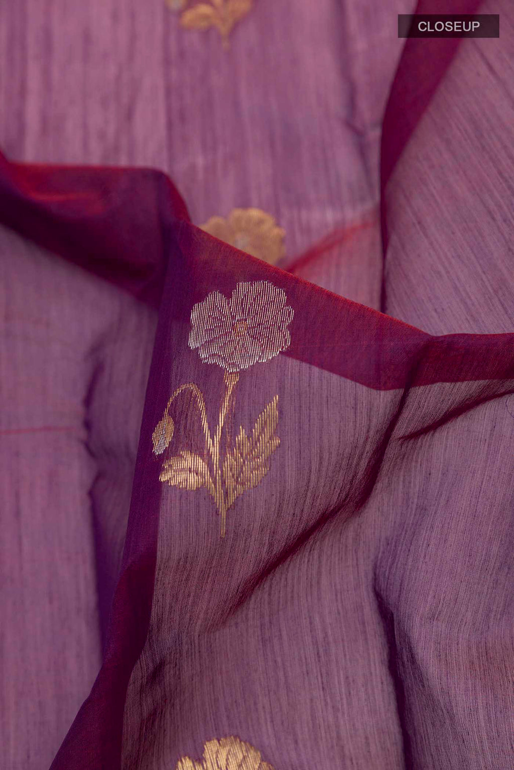 Close up of Purple Chanderi Silk Cotton Saree with Zari Butta on the body and Zari Border displaying folds