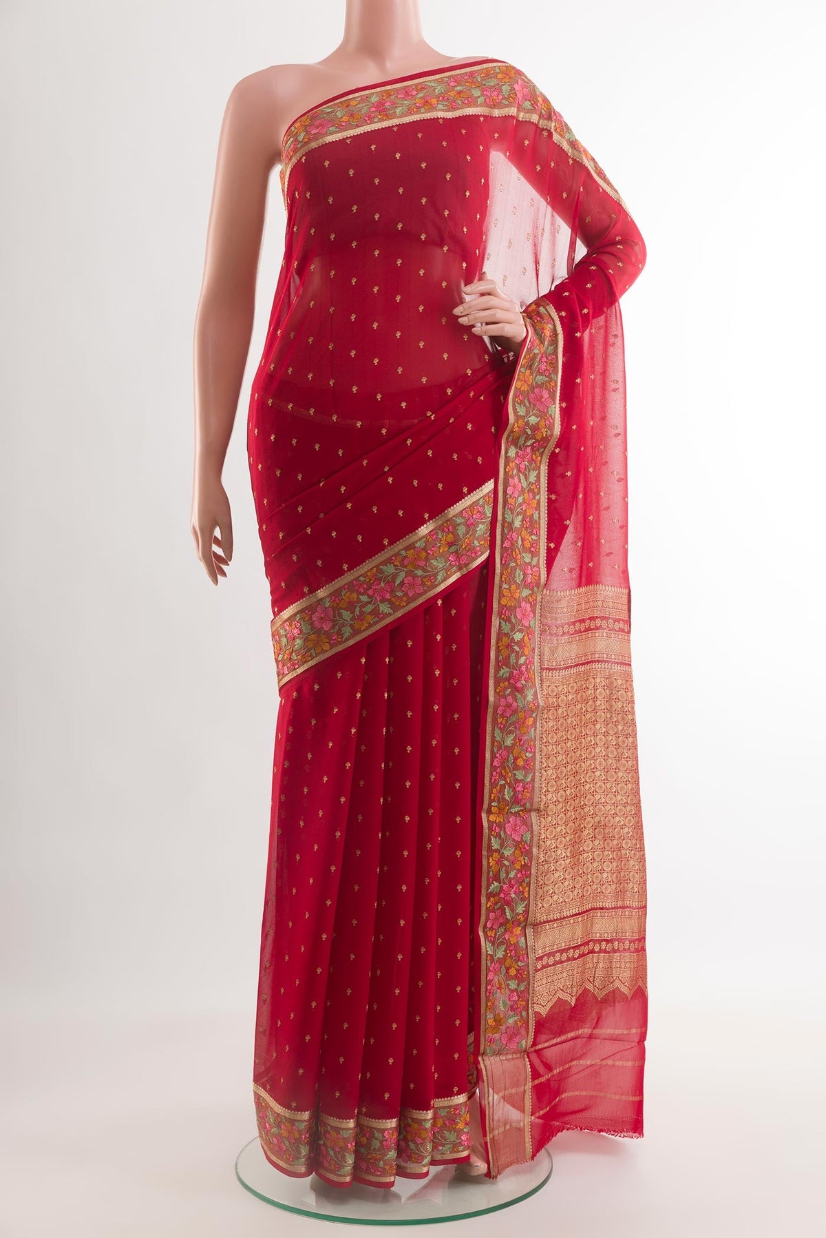 Red Mysore Chiffon Saree with Zari Butta on the body and Zari Border.  displayed on a mannequin