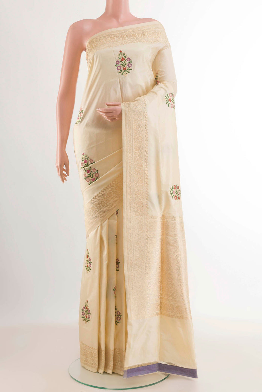 Cream Banarasi Silk Saree with Zari Butta on the body and Zari Border displayed on a mannequin