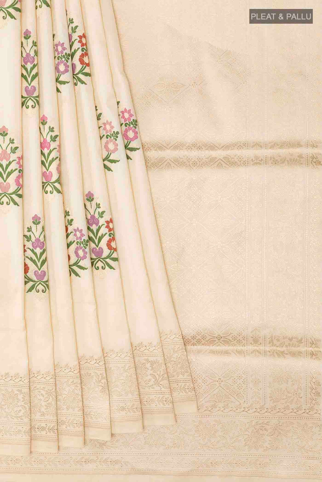 Pleats and pallu of Cream Banarasi Silk Saree with Zari Butta on the body and Zari Border