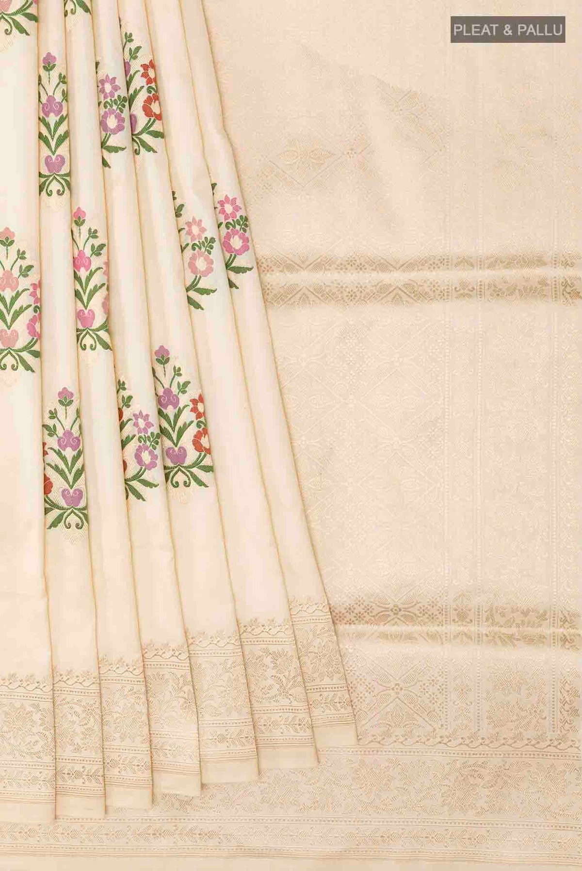 Pleats and pallu of Cream Banarasi Silk Saree with Zari Butta on the body and Zari Border