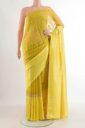 Yellow Banarasi Kora Silk Saree with Zari Butta on the body and Zari Border displayed on a mannequin