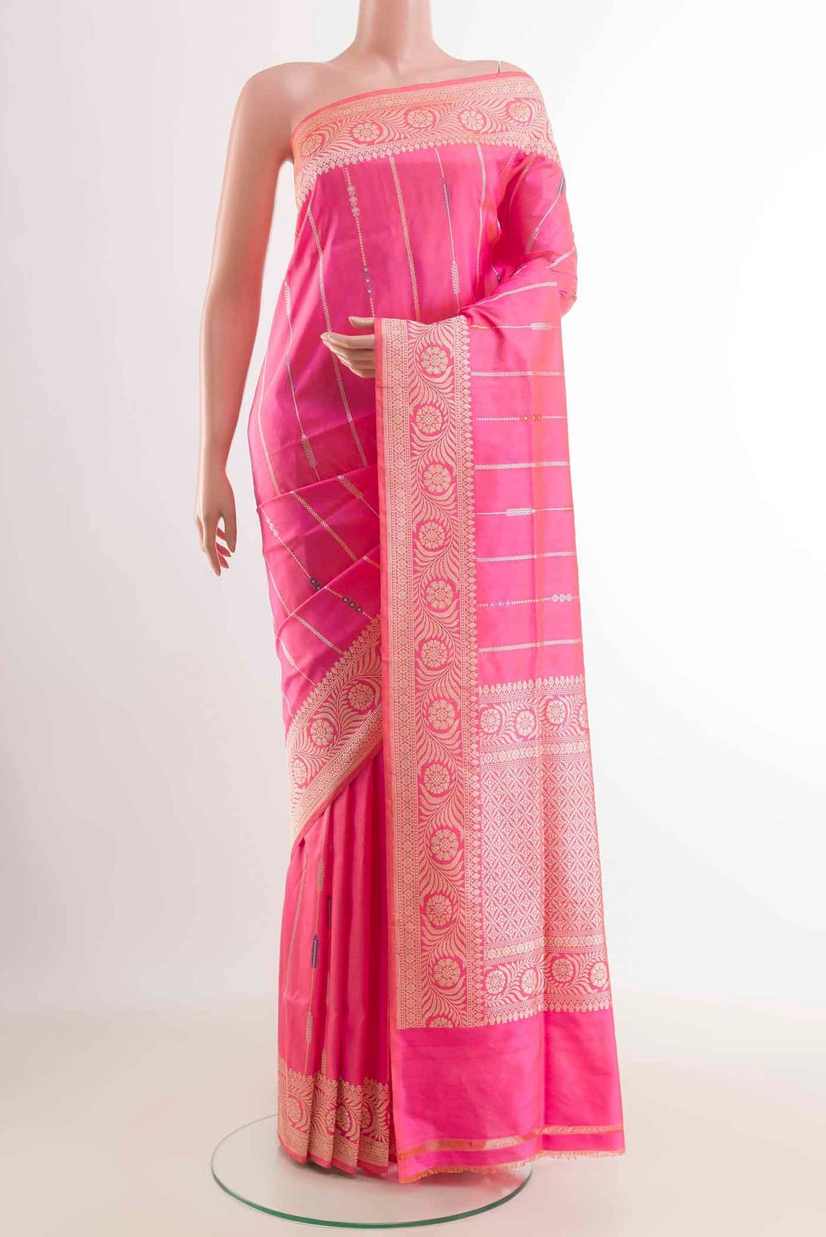 Pink Banarasi Silk Saree with Stripes on the body and Zari Border displayed on a mannequin