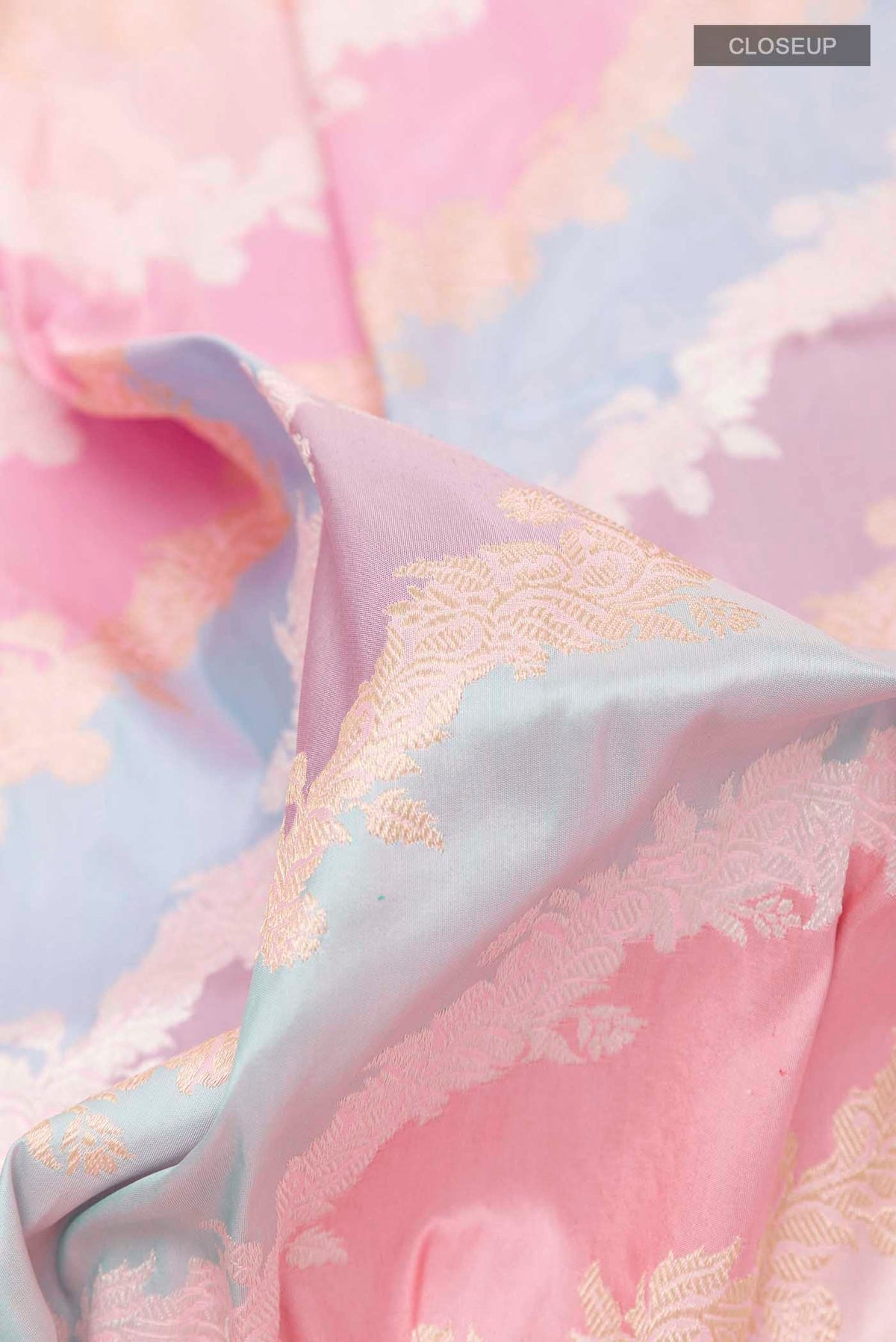 Close up of Multi Color Banarasi Silk Saree with Zari Brocade on the body and Zari Border displaying folds