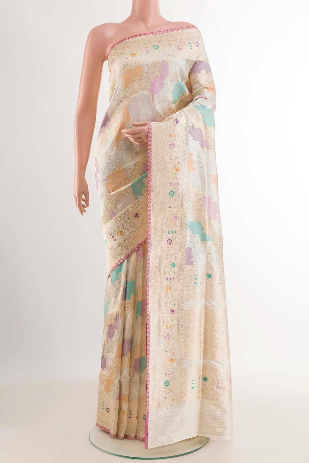 Off White Banarasi Silk Saree with Zari Brocade on the body and Zari Border displayed on a mannequin