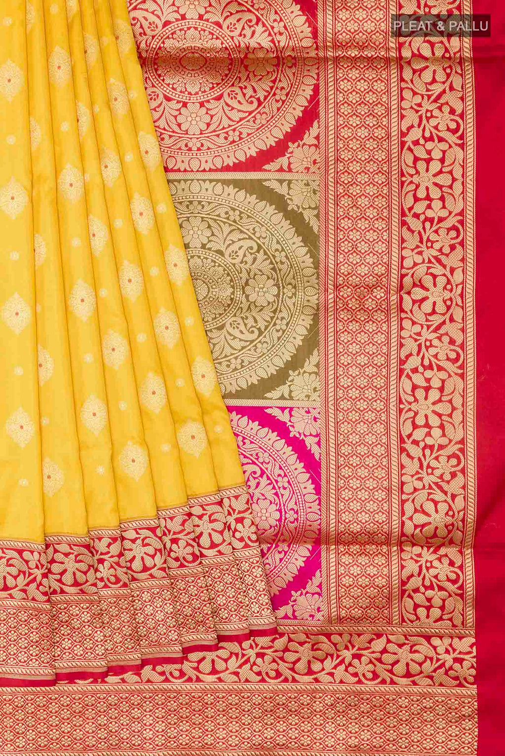 Pleats and pallu of Yellow Banarasi Silk Saree with Zari Butta on the body and Zari Border