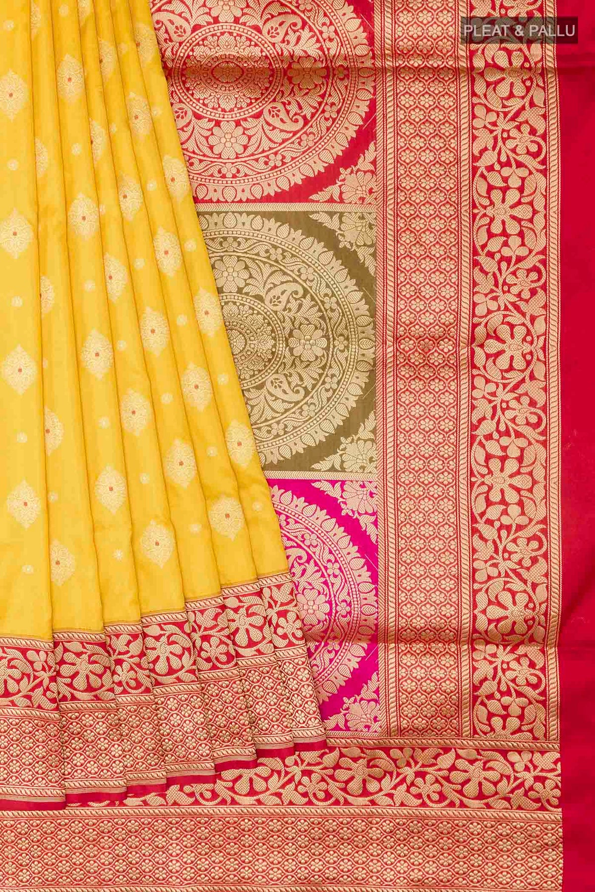 Pleats and pallu of Yellow Banarasi Silk Saree with Zari Butta on the body and Zari Border