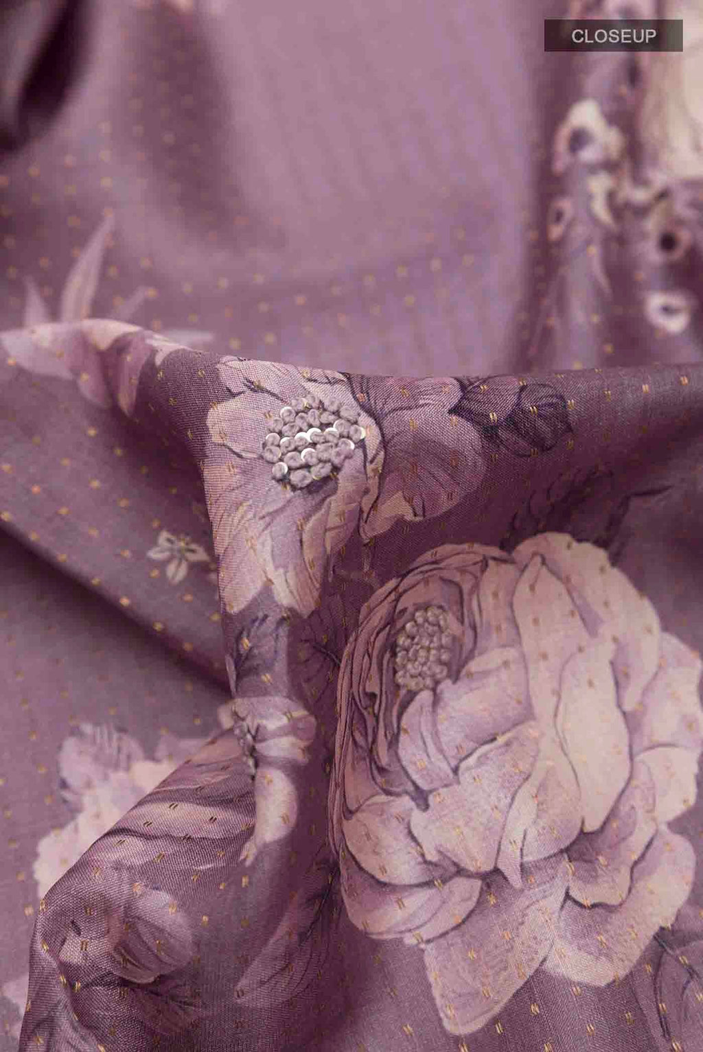 Close up of Lilac Tussar Saree with Printed design on the body and Thread Border displaying folds