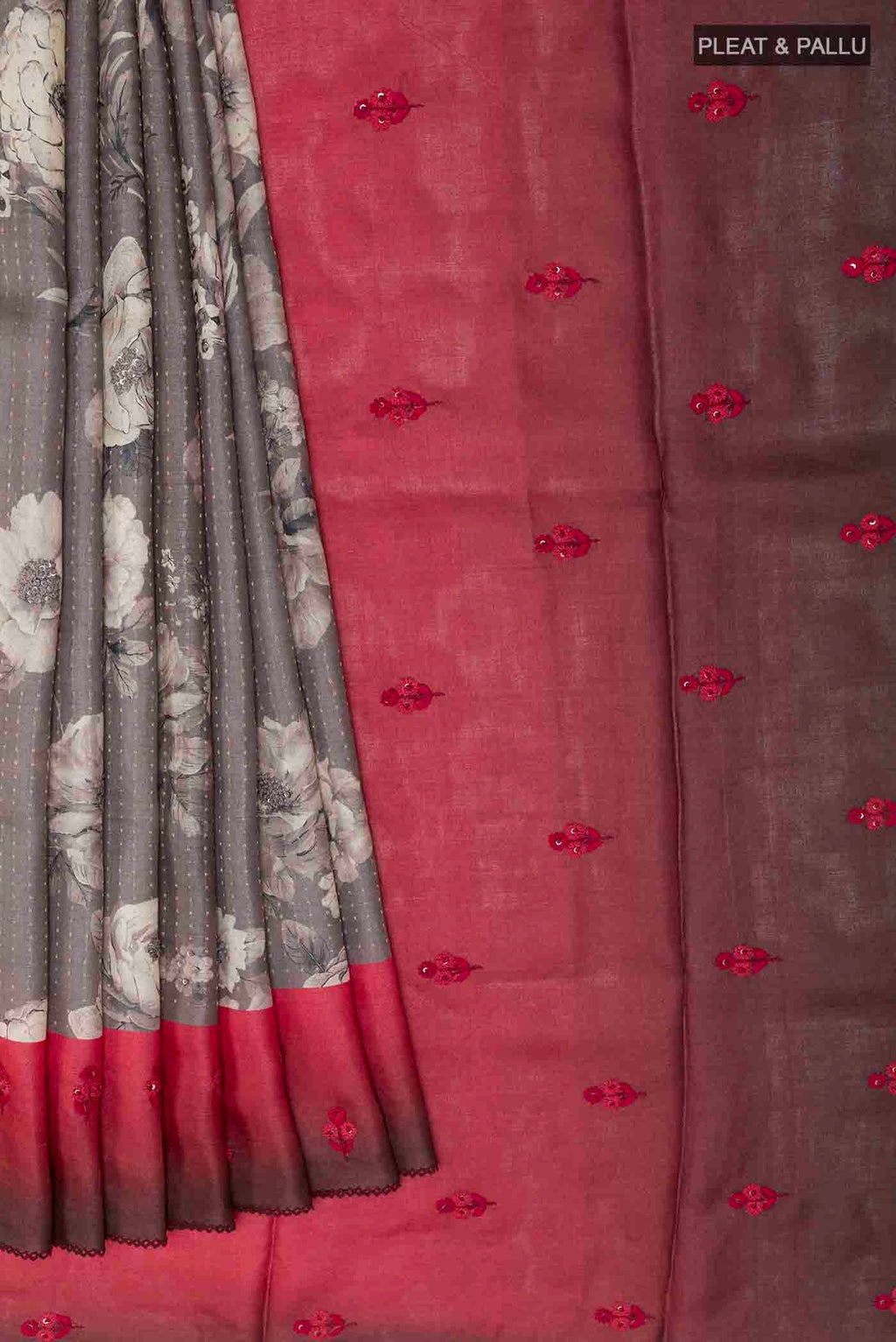 Pleats and pallu of Grey Tussar Saree with Printed design on the body and Thread Border