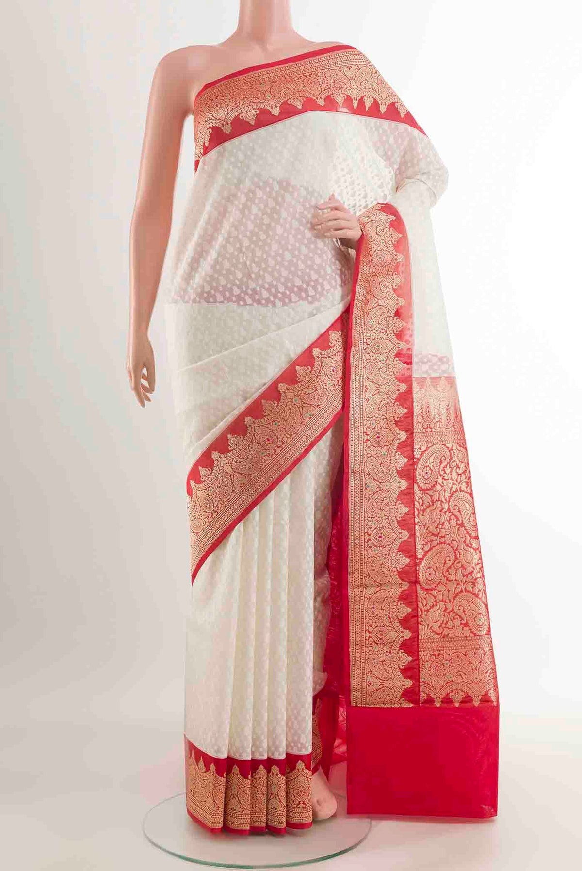 White Banarasi Kora Cotton Saree with Jacquard design on the body and Zari Border displayed on a mannequin