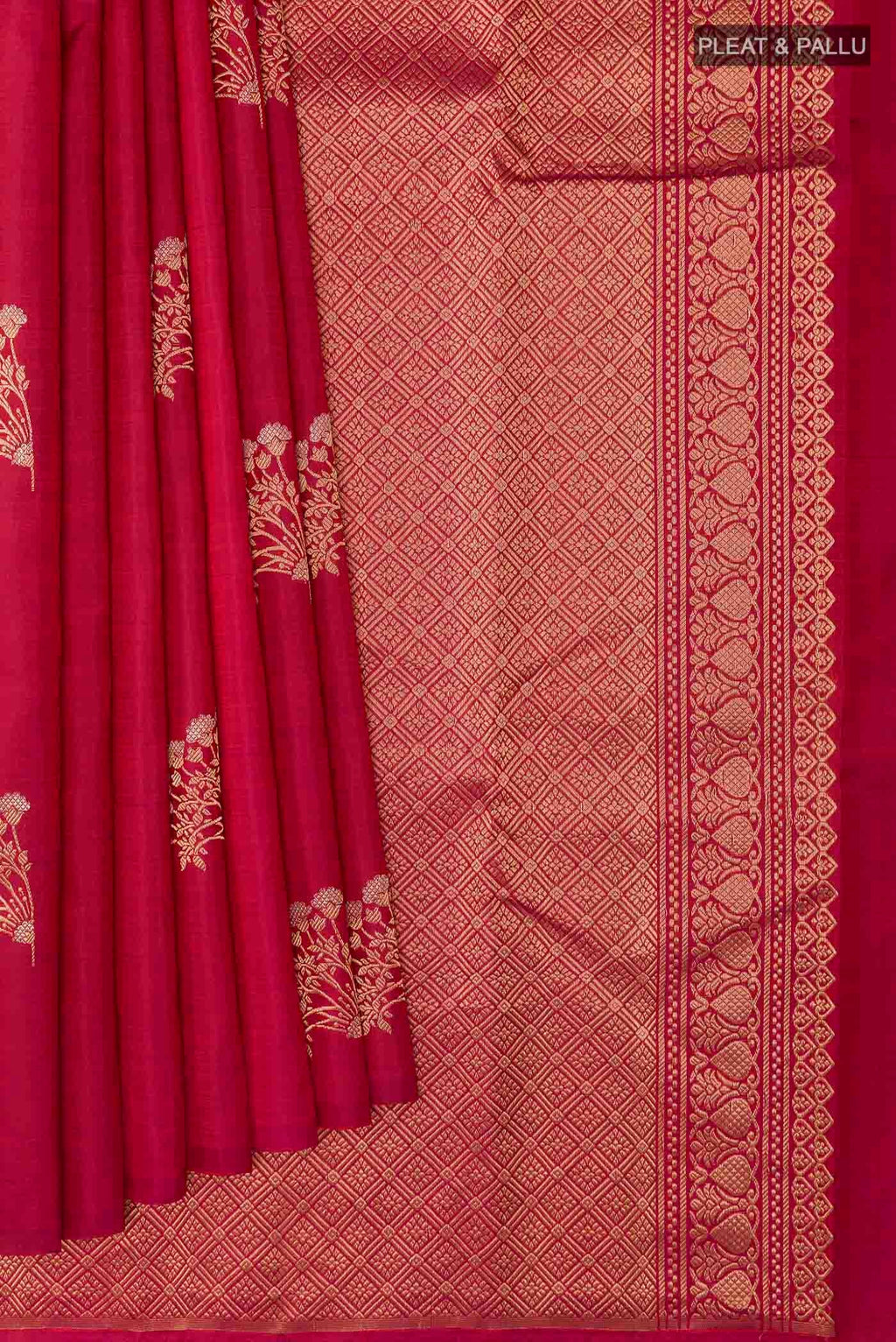 Pleats and pallu of Maroon Kanchipuram Silk Saree with Zari Butta on the body and Zari Border