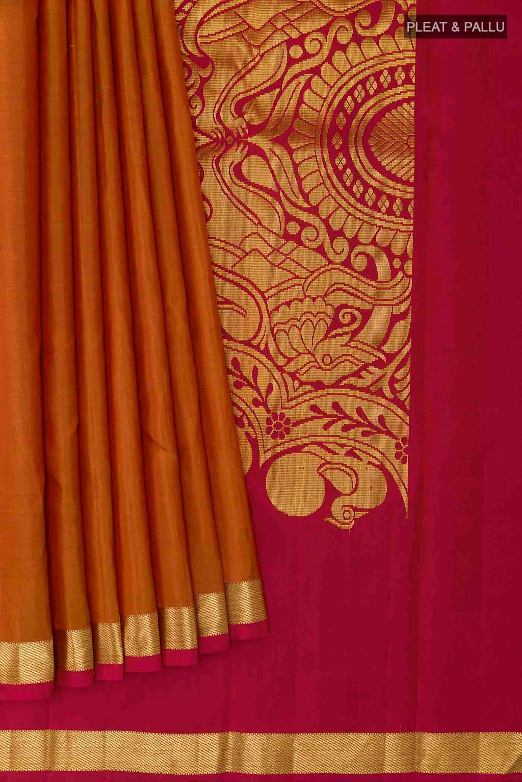 Pleats and pallu of Brick Orange Kanchipuram Silk Saree with Plain Body and Zari Border