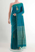 Peacock Blue Soft Silk Saree with Zari Butta on the body and Zari Border displayed on a mannequin