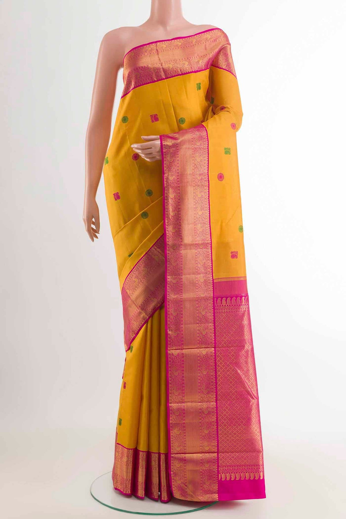 Yellow Kanchipuram Silk Saree with Thread Butta on the body and Zari Border displayed on a mannequin