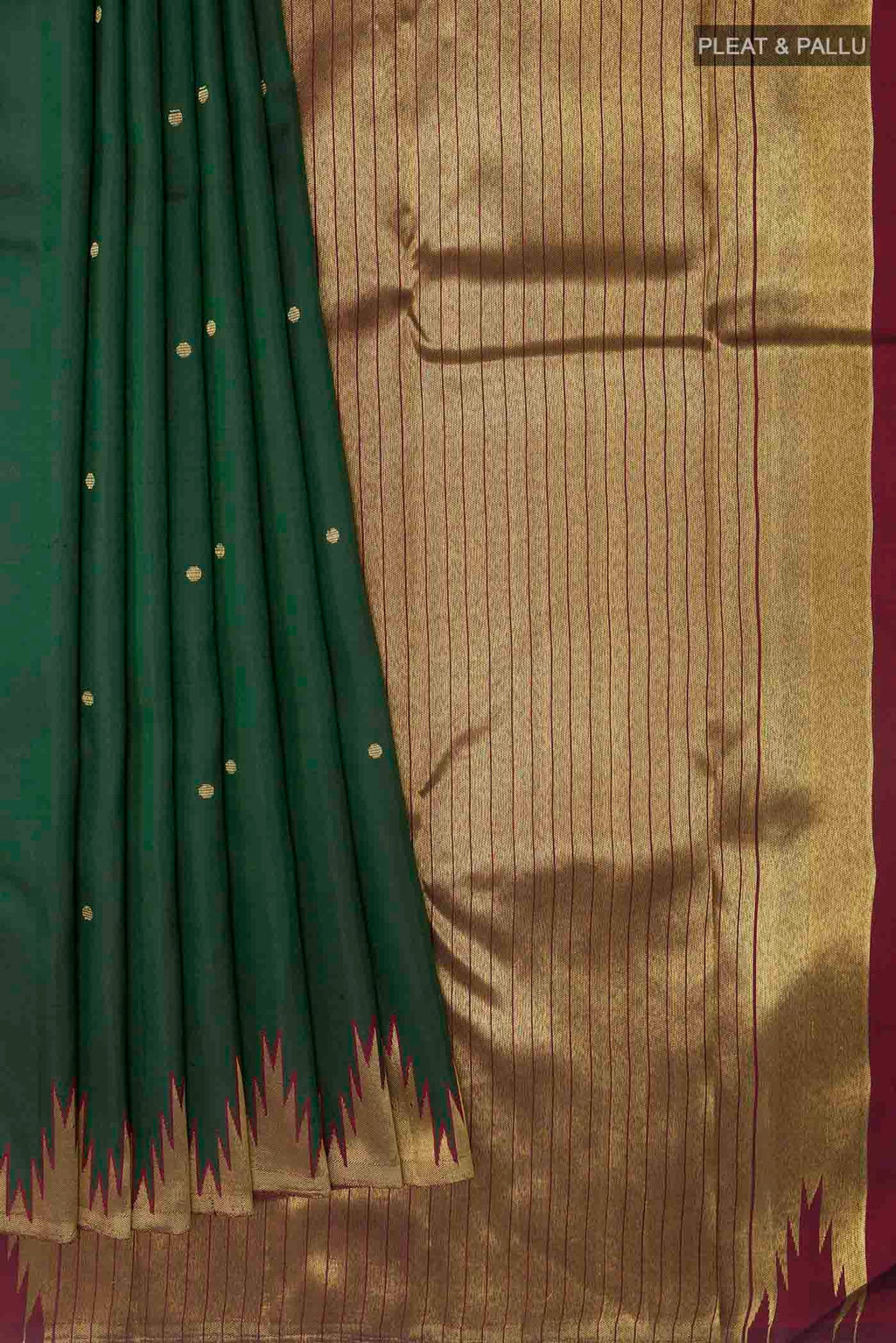 Pleats and pallu of Bottle Green Kanchipuram Silk Saree with Zari Butta on the body and Zari Border