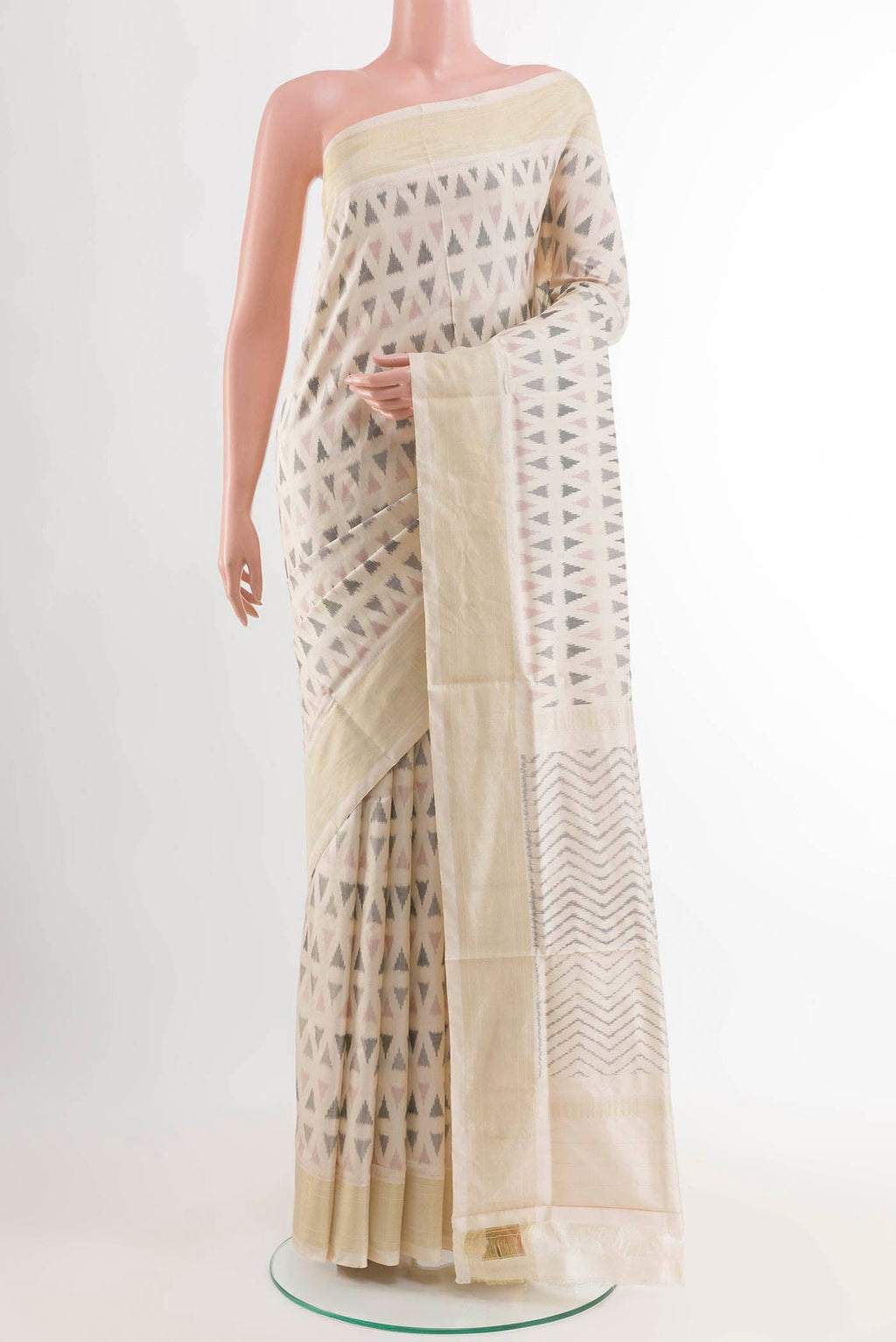 Off White Pochampally Silk Saree with Pure Ikat on the body and Zari Border displayed on a mannequin