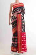 Black Pochampally Silk Saree with Pure Ikat on the body and Zari Border displayed on a mannequin
