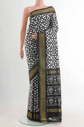 Off White Pochampally Silk Saree with Pure Ikat on the body and Zari Border displayed on a mannequin