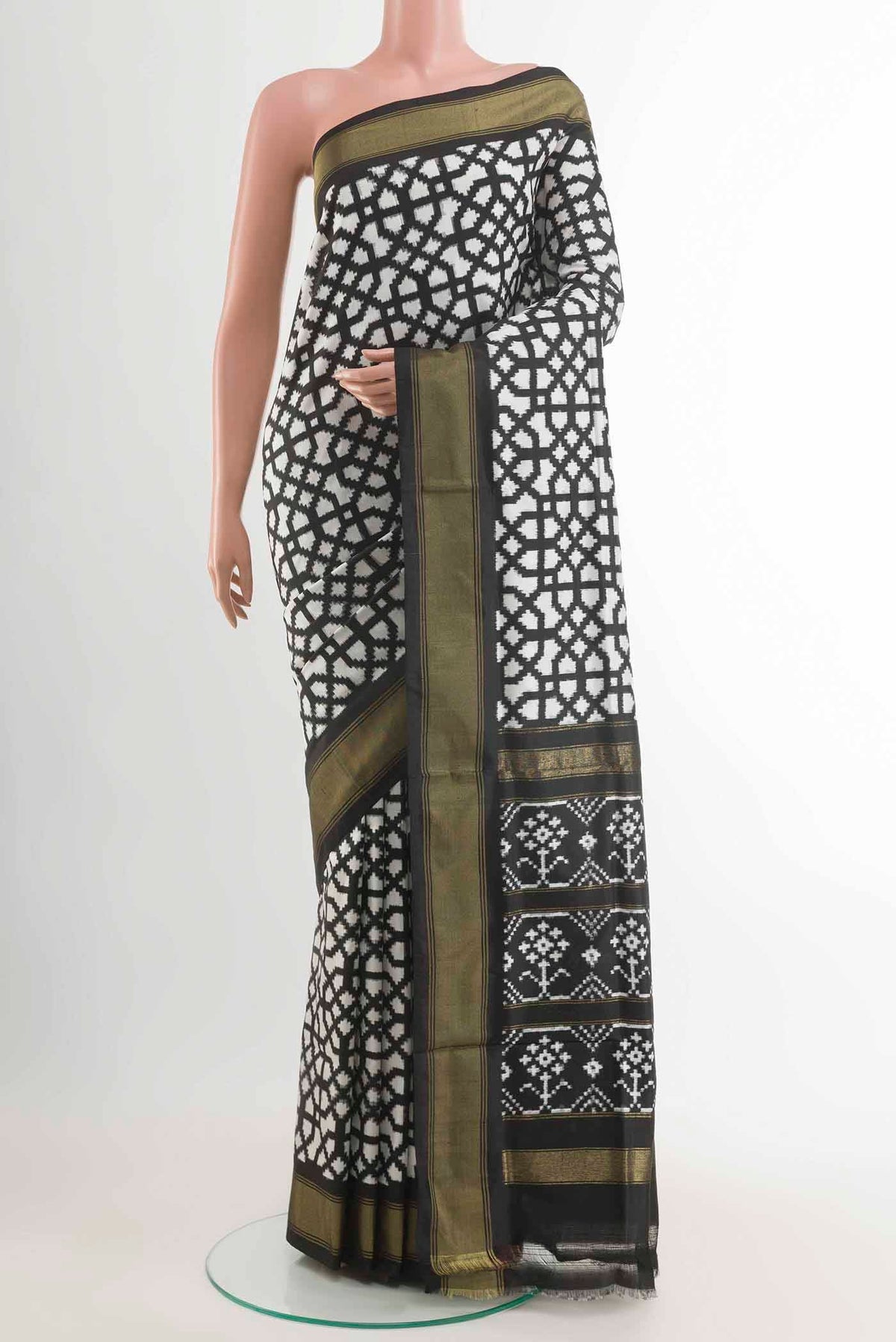 Off White Pochampally Silk Saree with Pure Ikat on the body and Zari Border displayed on a mannequin
